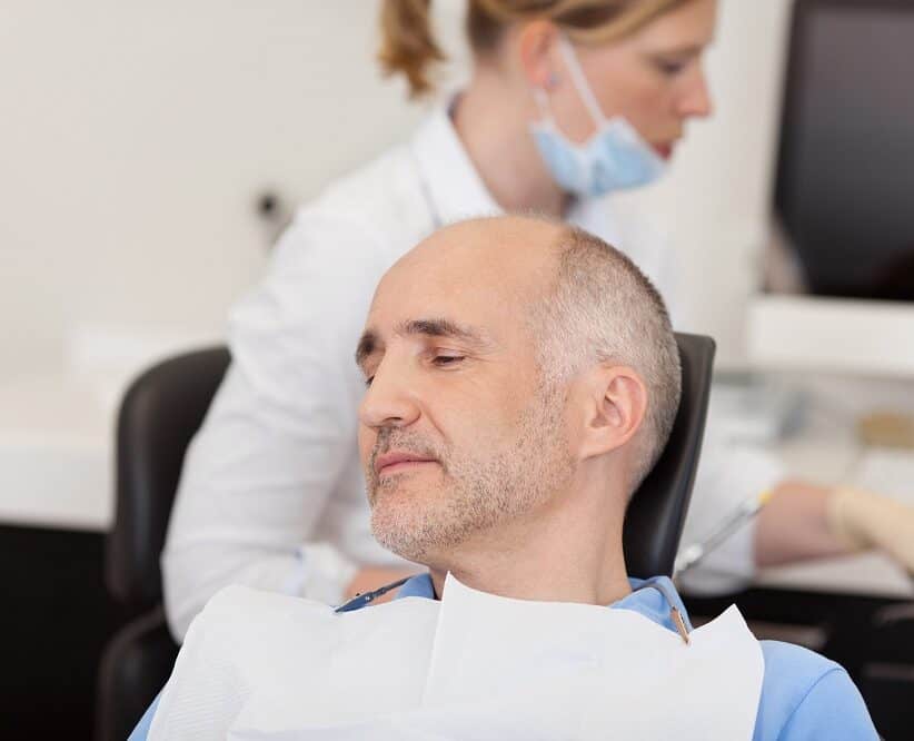 men taking partial dentures treatment